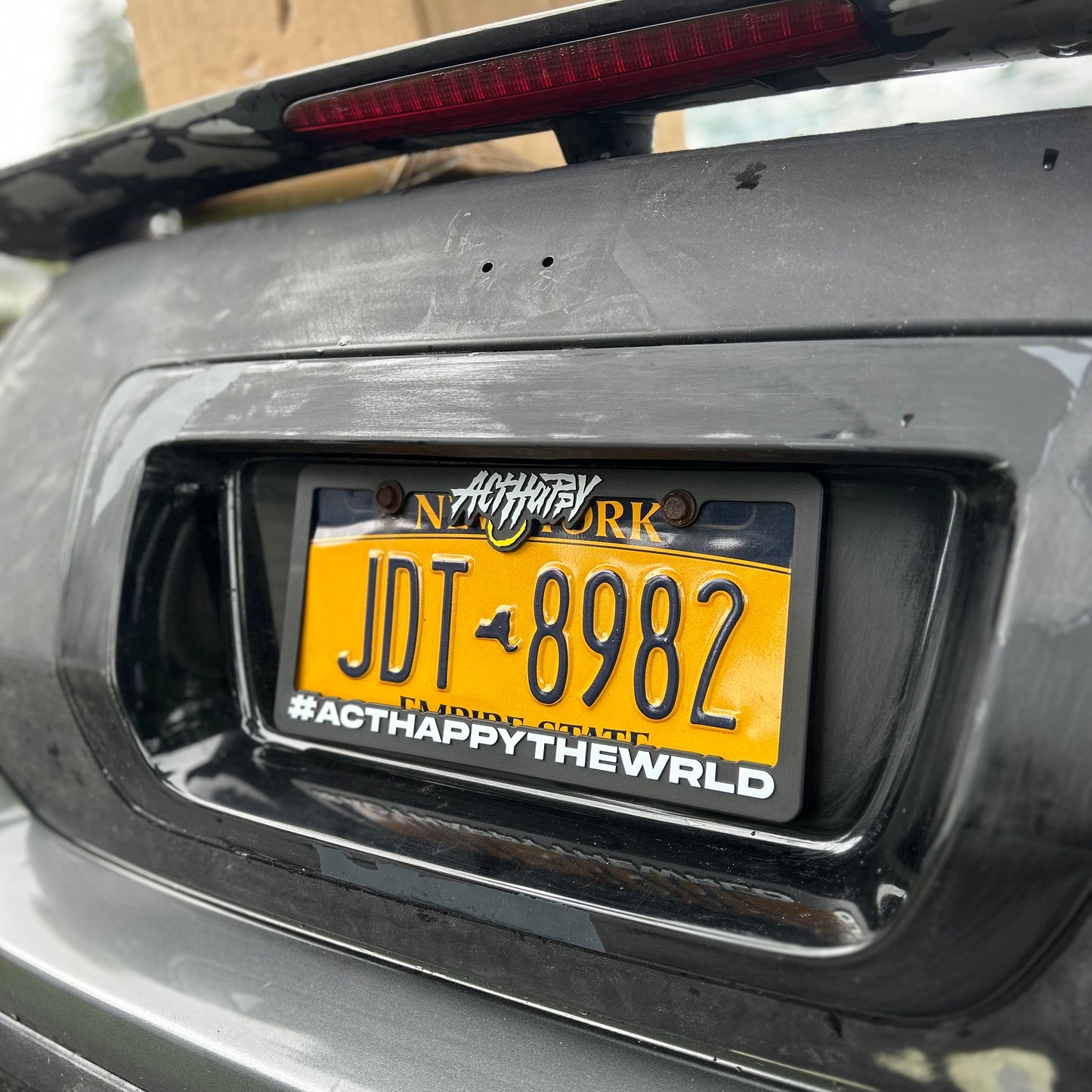 ActHappyTheWrld License Plate Frame
